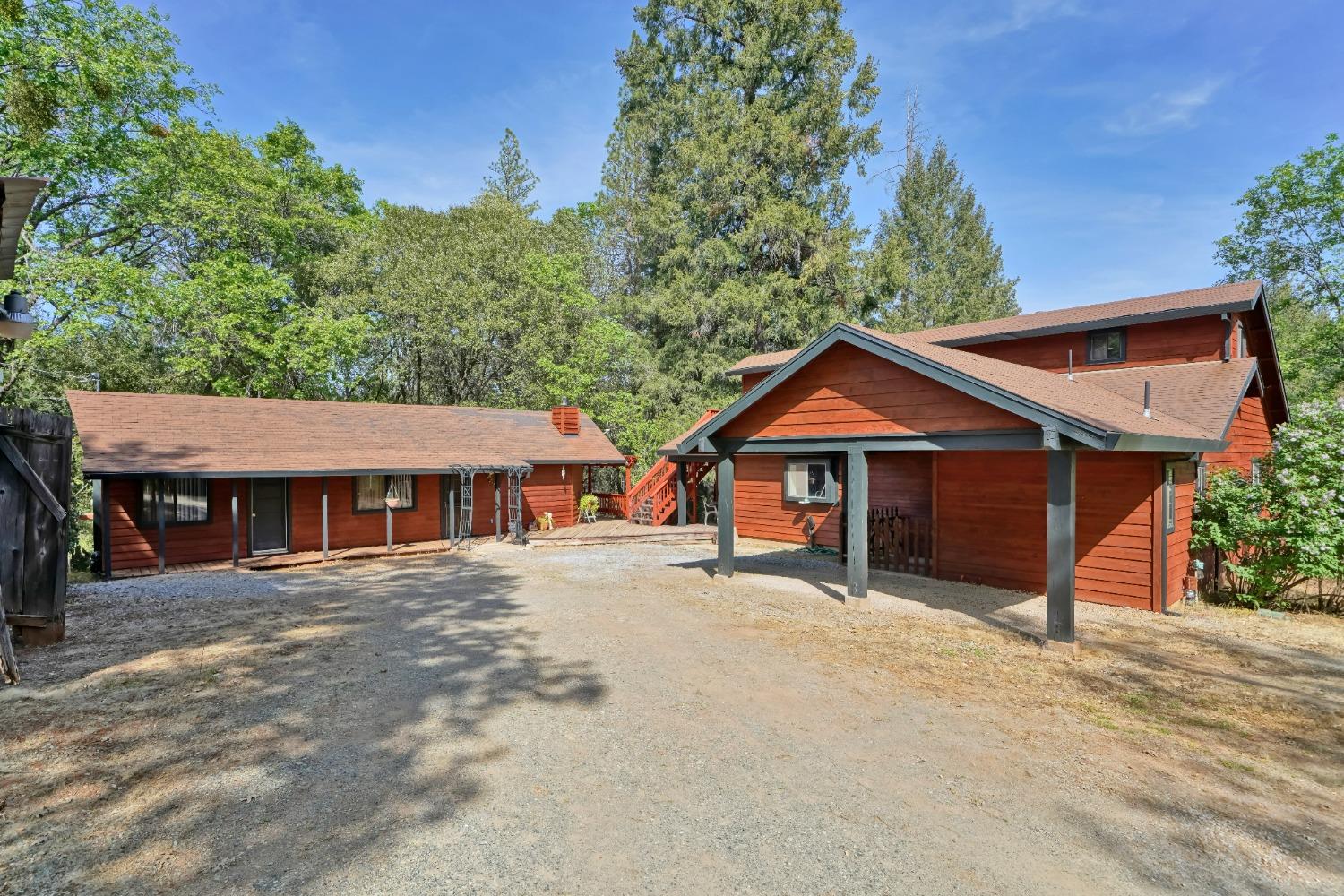 Sweat Equity will be key with this very private family compound. 2 small older homes are livable while you build your dream home. Several view spots to choose. Large poll barn for storage as well as Large barn/garage and outbuildings. Very special and private location. Only 20 minutes to Placerville and there is everything you need in town just minutes away.