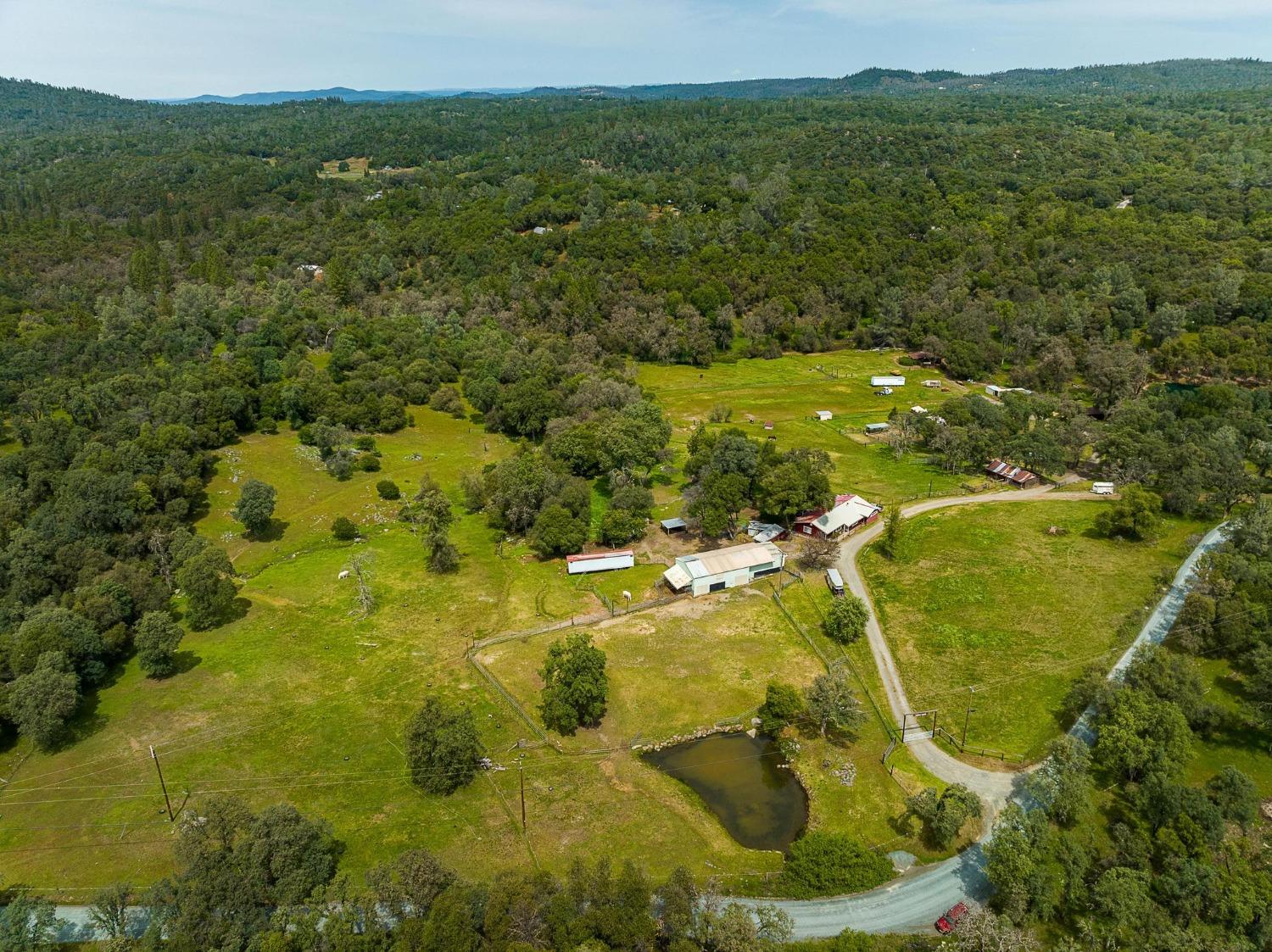 Overview - barn, pond, Main House, pastures, small arena