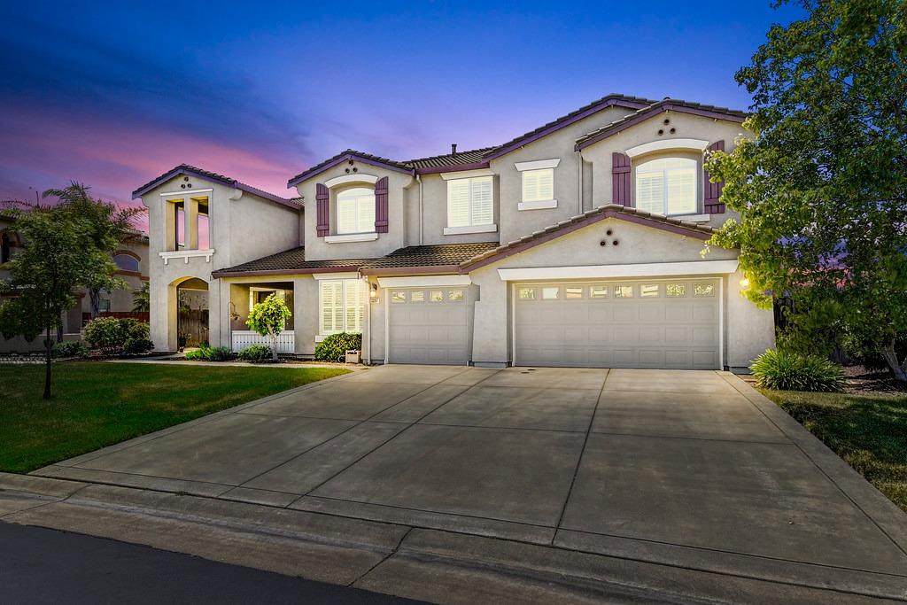 This awe-inspiring spacious home, bathed in natural light, is located in the gated, peaceful community of Wild Wings. As you enter the front door, take in the majestic staircase, soaring ceilings, stone floors & open floor plan. With over 4800 sq. ft., every space you may wish for is yours, from the formal dining room to casual dining space, living room or family room, billiard room or office space. The kitchen features beautiful wood cabinetry, granite countertops, a center island, pantry & double ovens. Prepare your favorite cocktail in the primary suite wet bar and take in the sunset & golf course views from the balcony or cozy up to the primary bedroom fireplace. The backyard will make you feel as if you are vacationing at a private resort. The views extend for miles. An inviting pool beckons you and the yard space will keep your pets and kids endlessly happy.  Owned 7.9 KW solar system, pool solar, plantation shutters, built-in sound system, 3 car garage & so much more