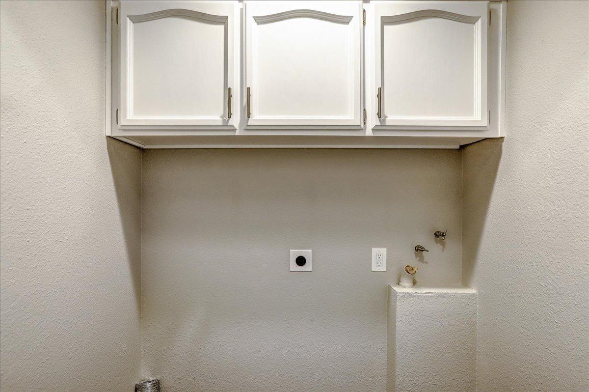 Laundry closet in hallway.