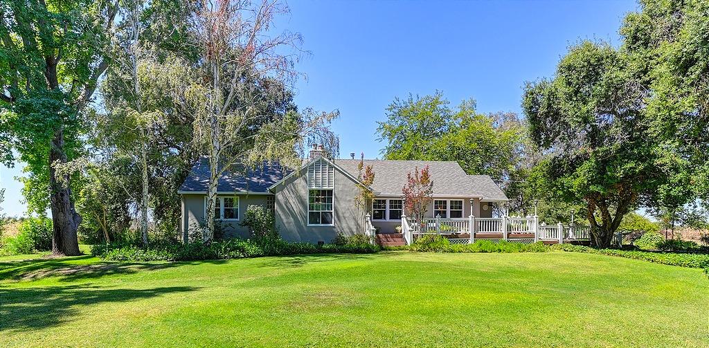 Enjoy the relaxing Delta lifestyle along the Sacramento River on this rare and unique bucolic settin