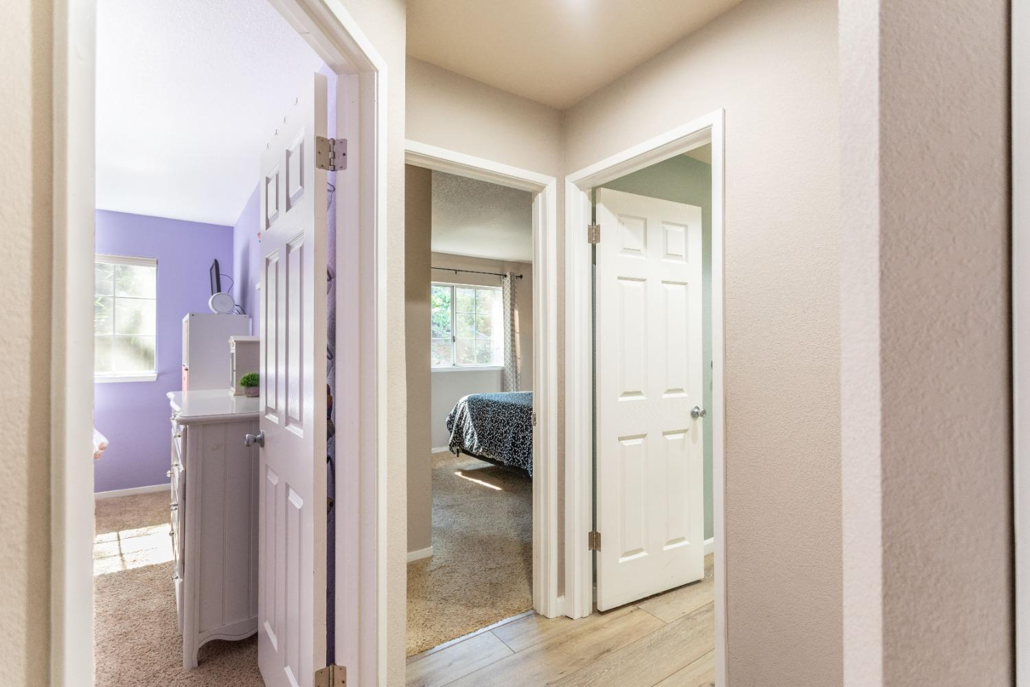 Doors lead to bedroom #1, Bedroom #2, and hall bath