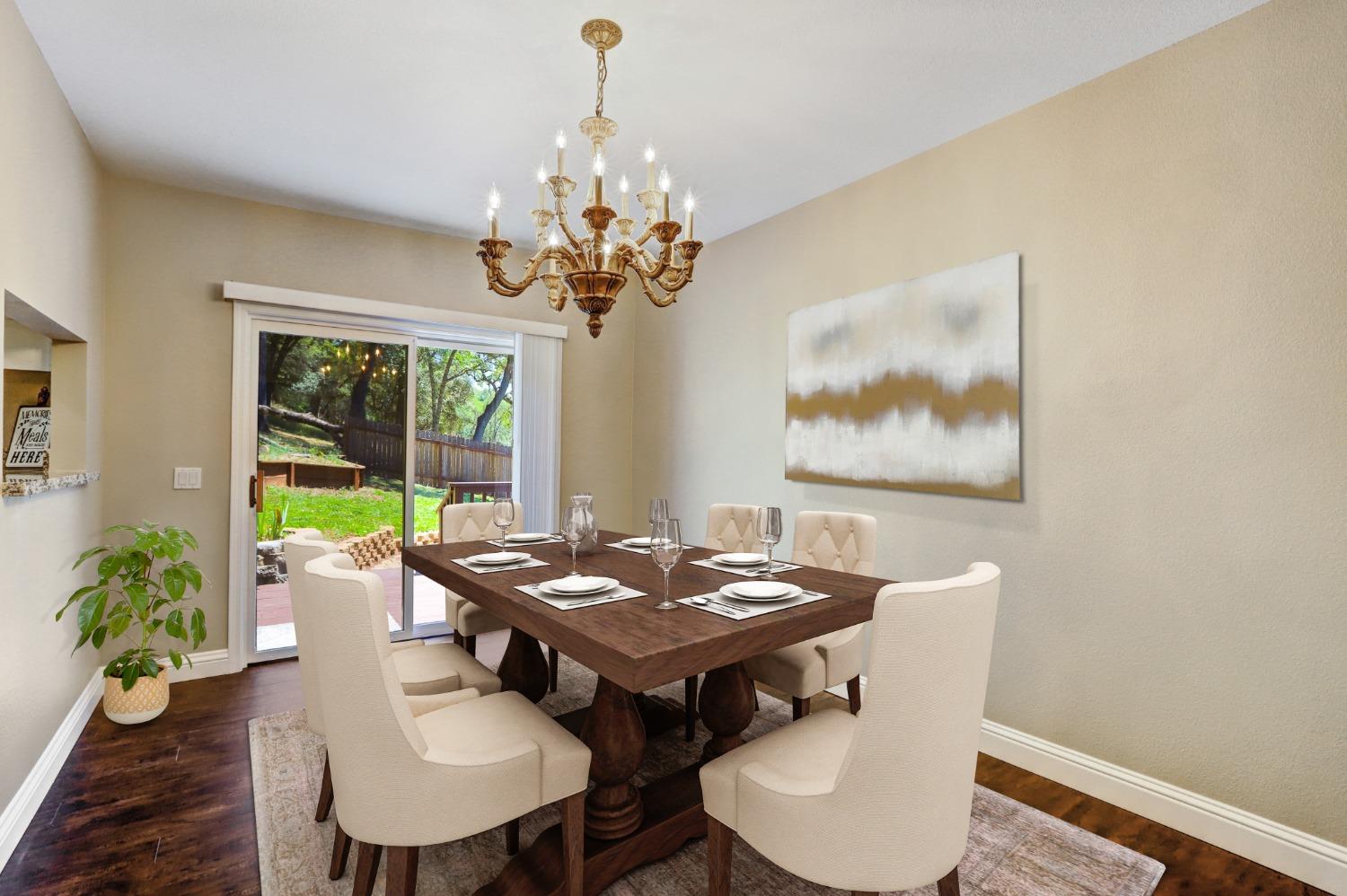 Dining room with pass-through window from kitchen, shown with digitally enhanced furniture.