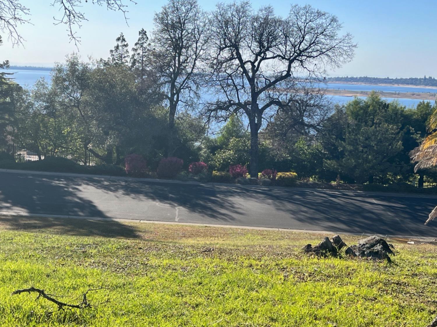 One of the last remaining premier lots in The Summit, one of the most desirable gated communities in El Dorado Hills. Excellent schools.   First time on market in 20 years. Entire lot is easily walkable.  Trees, few granite outcroppings on side of lot.  Folsom Lake views. Sit on the front deck and watch the beautiful sunsets over the lake.  The Summit has tennis courts, playground, BBQ area and easy access to Folsom Lake trails. Wide, sweeping streets, wildlife, many trees. Low HOA, no Mello-Roos.  Water/sewer paid.