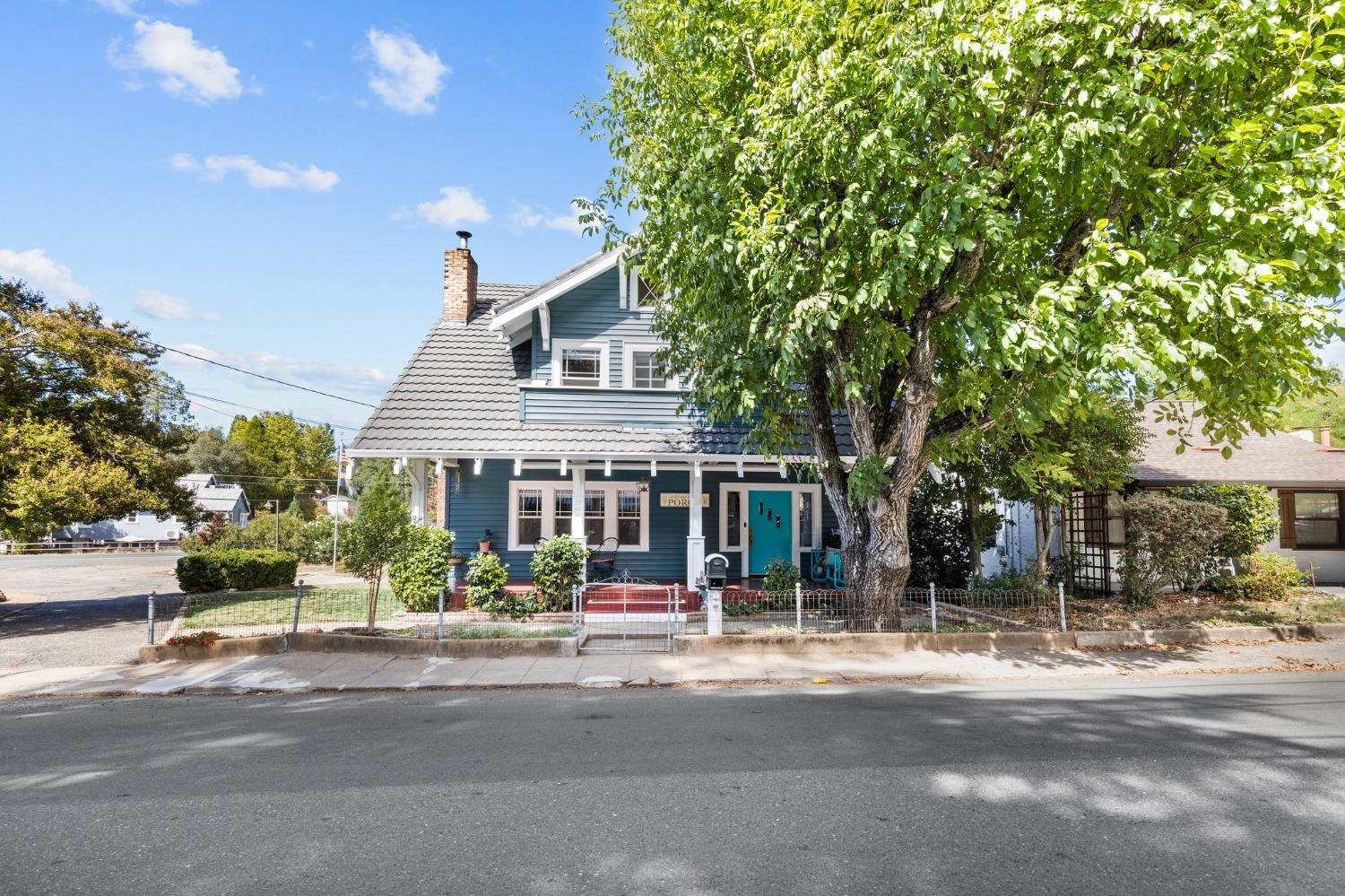 1906 Craftsman beauty. This home has been meticulously restored & remodeled by its present owners. This home was in the same family for 108 years! You step up to the home & you are greeted by the large front porch perfect for relaxing. As you open the wide front door, flanked on both side by stained glass windows, you step in to the large parlor. As you pass through the wood beam & colunms into the living room with its tiled fireplace & wood burning insert, you will see two additional stained glass windows. The large dining room as stained & painted wood paneling & a built-in hutch. The kitchen was expanded & is an entertainers dream. Tons of cabinet space and large island with quartz countertops. Elmira dual fuel range/oven. The large farm style sink looks out 3 windows that let in lots of natural light. There is a laundry room off of the kitchen with built in cabinets & folding counter. There is a bedroom & full bath on the main level. Upstairs you will find the primary suite with a full bath & walk-in closet. There are 2 other bedrooms upstairs & attic space for storage. The backyard has a covered kitchen/BBQ area with tile counters, sink, & bar seating. The home has a full basement for storage & the homes mechanicals. Just 9 miles from Sutter Creek in affordable Jackson.