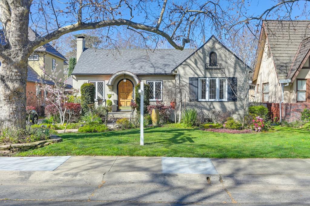 Curtis Park Cottage with incredible curb appeal!  Beautiful hardwood floors, leaded glass windows an