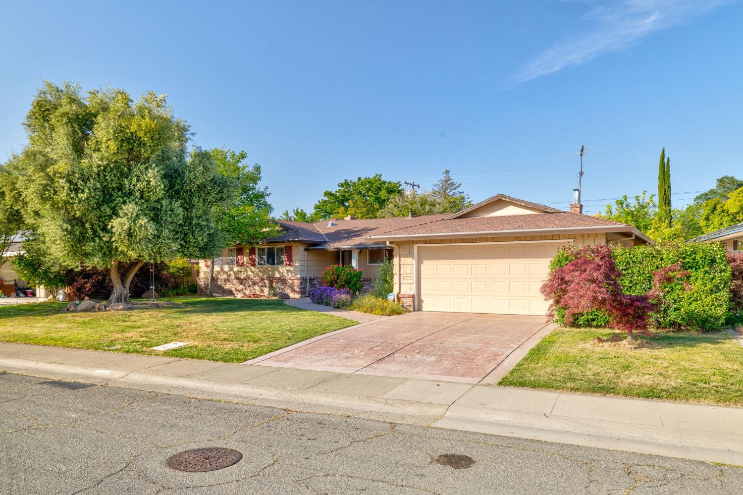 This charming 1960's ranch style home on a large 1/4 acre lot in the highly sought after neighborhoo