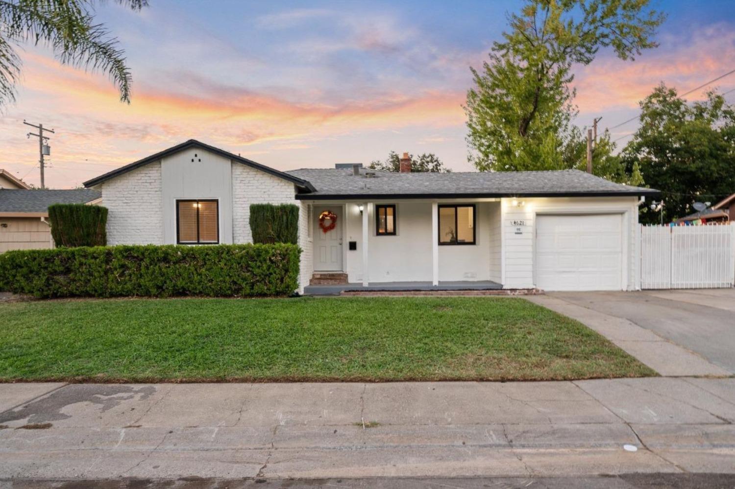 Welcome to this beautifully updated home with 3 bedrooms and one bath that's ready for you to move right in! Featuring a fully remodeled kitchen with quartz countertops, brand new cabinets, and modern appliances, this space provides plenty of storage and is perfect for cooking and entertaining. The kitchen flows effortlessly into the great room with a combo dining and living room, where a cozy brick fireplace adds character and charm to the space. Along with the fully updated kitchen and bathroom, this home offers a number of new and recent updates including laminate plank flooring throughout, updated roof, updated sewer line and newer HVAC system to ensure comfort and peace of mind. The three spacious bedrooms offer plenty of natural light and room to relax. The large backyard, with oversized side gate provides a great space for storing equipment or enjoying some gardening, entertaining, or unwinding after a long day. Located on a quiet street close to schools, parks, and shopping, this home is the perfect blend of updated style and convenience.