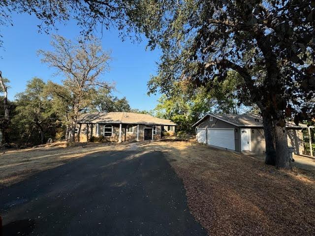 Come check this beauty out. Enjoy the country style living. This 3 bedroom 2 full bathroom .Sits on Almost one acre lot (0.91 acre). Plenty of natural light. Beautiful kitchen with granite counter tops. Beautiful views from the kitchen. Brand new water proof flooring thru out the house. Dual pane windows. Newer Bathrooms. Inside laundry area. Stucco on exterior. Brand new paint outside. Detached 3 car garage. Plenty of room to park your RV and boat. 2 sheds. Located on a small street. Its a split level home. Kitchen, dining and family room has 3 stairs. Bedrooms and bathroom on ground level .Its a must see.