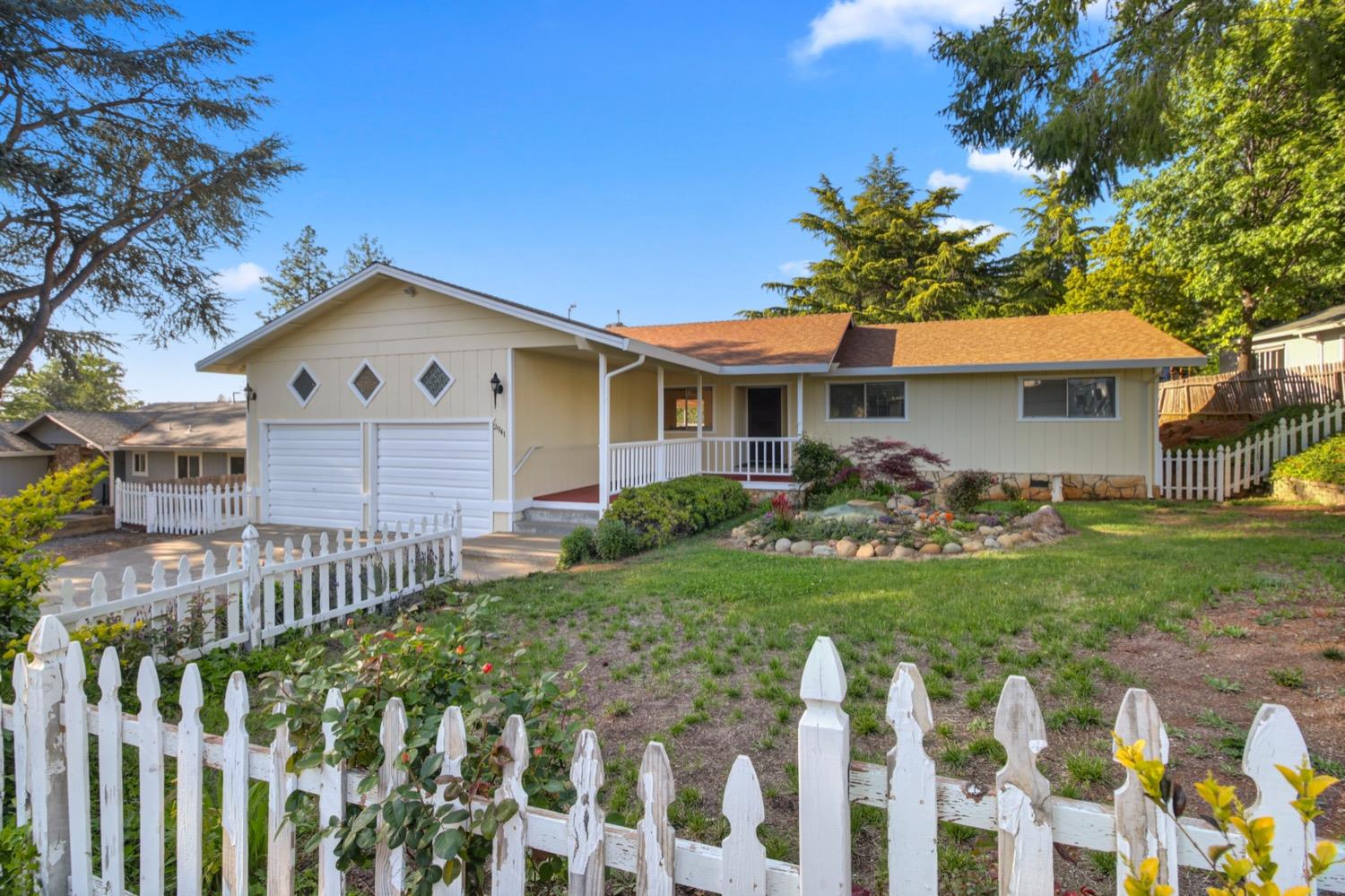 2941 Camino Heights Drive Camino, California ADORABLE, CLEAN, VIEWS, GARDEN! Welcome home to this 3 bedroom, 2 bathroom home in the highly desired Camino Heights neighborhood. Filled with natural light and green space views(previously the golf course),this well maintained home has so much to offer including an open kitchen (remodeled in 2013 and custom cabinets installed)with an attached dining area, adjacent living room with custom built- in cabinets and beautiful pellet stove (just inspected and new pipes installed!) with french doors to the backyard. Step outside the living room to a fully covered deck with views of the backyard and beyond to the park like meadow. HVAC maintained and serviced 2025. Roof is 12 years new! Brand new carpet in the living room. Freshly painted exterior and decking paint (2025). Oversized 2 car garage has room for a workshop. Extra wide driveway can accommodate RV/boat parking. This property has multiple fruit producing trees/bushes including marion berries, cherries, apples, and grapes. Brand new stairs built outside laundry room too! Camino Heights neighborhood boasts walking trails and close proximity to HWY 50, wineries/breweries, Apple Hill, restaurants, and schools.